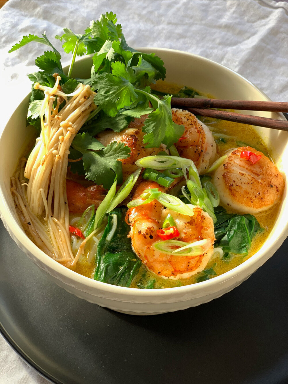 YELLOW THAI CURRY SOUP WITH SEAFOOD, SPINACH AND NOODLES